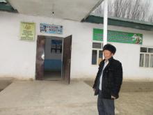 Alimhonov Nishon, School Principal in front of new additional school facility